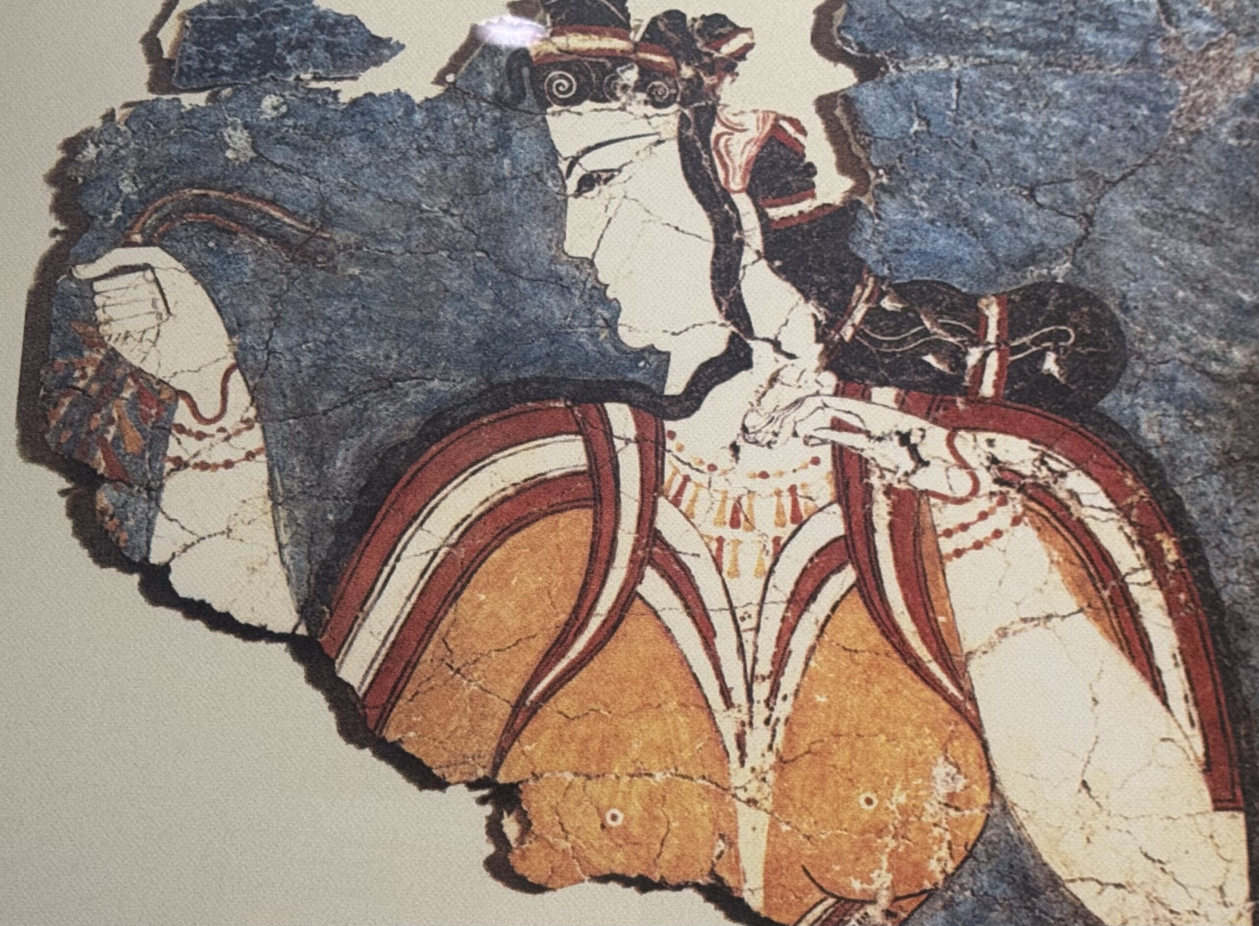 IMG_9264 Mycenaean Lady Fresco found at the Acropolis of Mycenae - Taussig Travel Fragment of a vintage painting showing a rider on a brown horse with red tack, texture and cracks visible on the canvas.